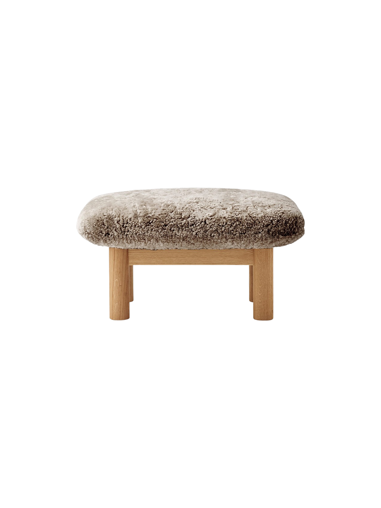 Front view of the Brasilia Ottoman, featuring a plush sheepskin cushion in a natural colour on a natural oak wood frame.