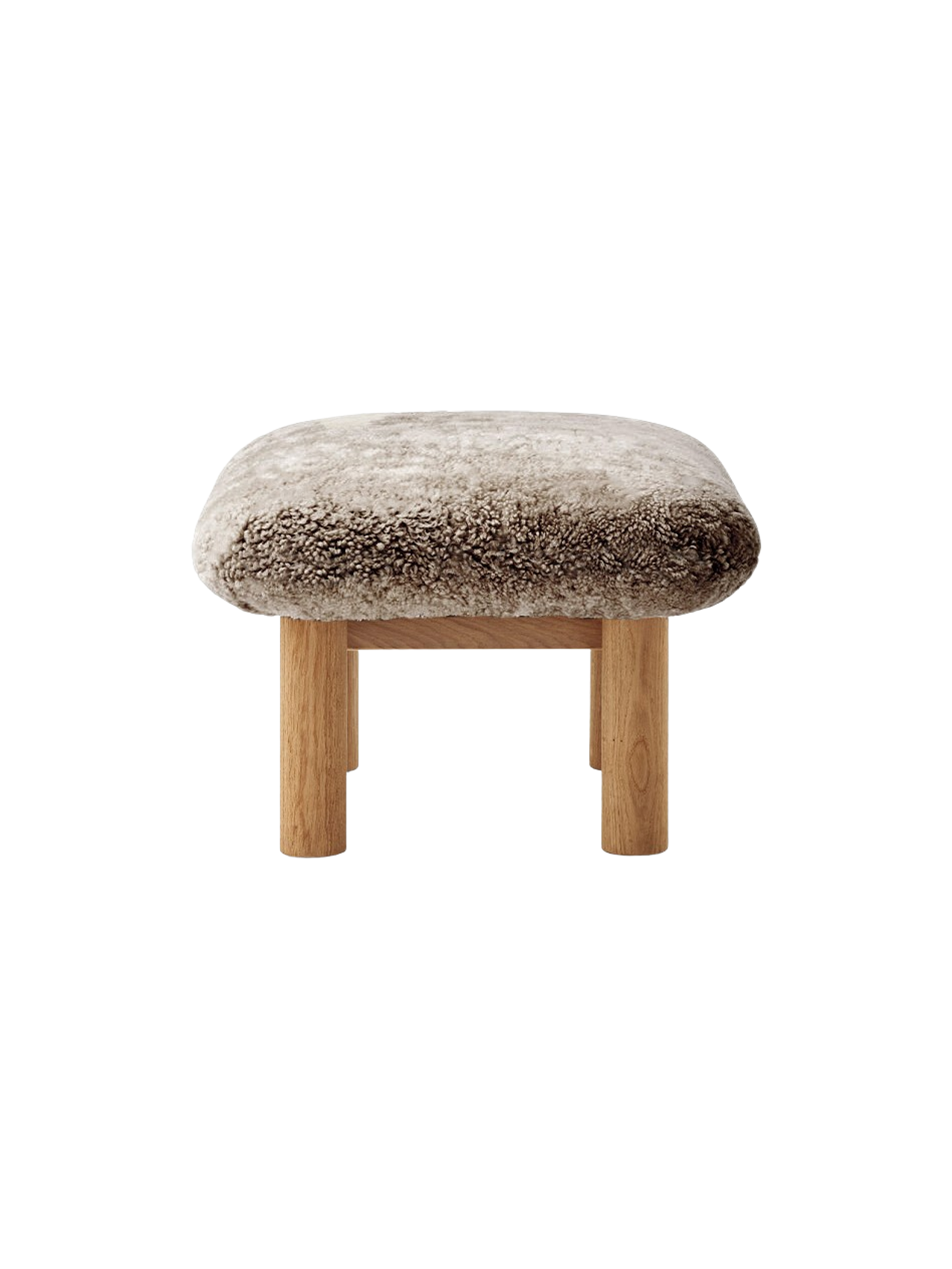 Side view of the Brasilia Ottoman with a plush natural sheepskin cushion and cylindrical natural oak legs.