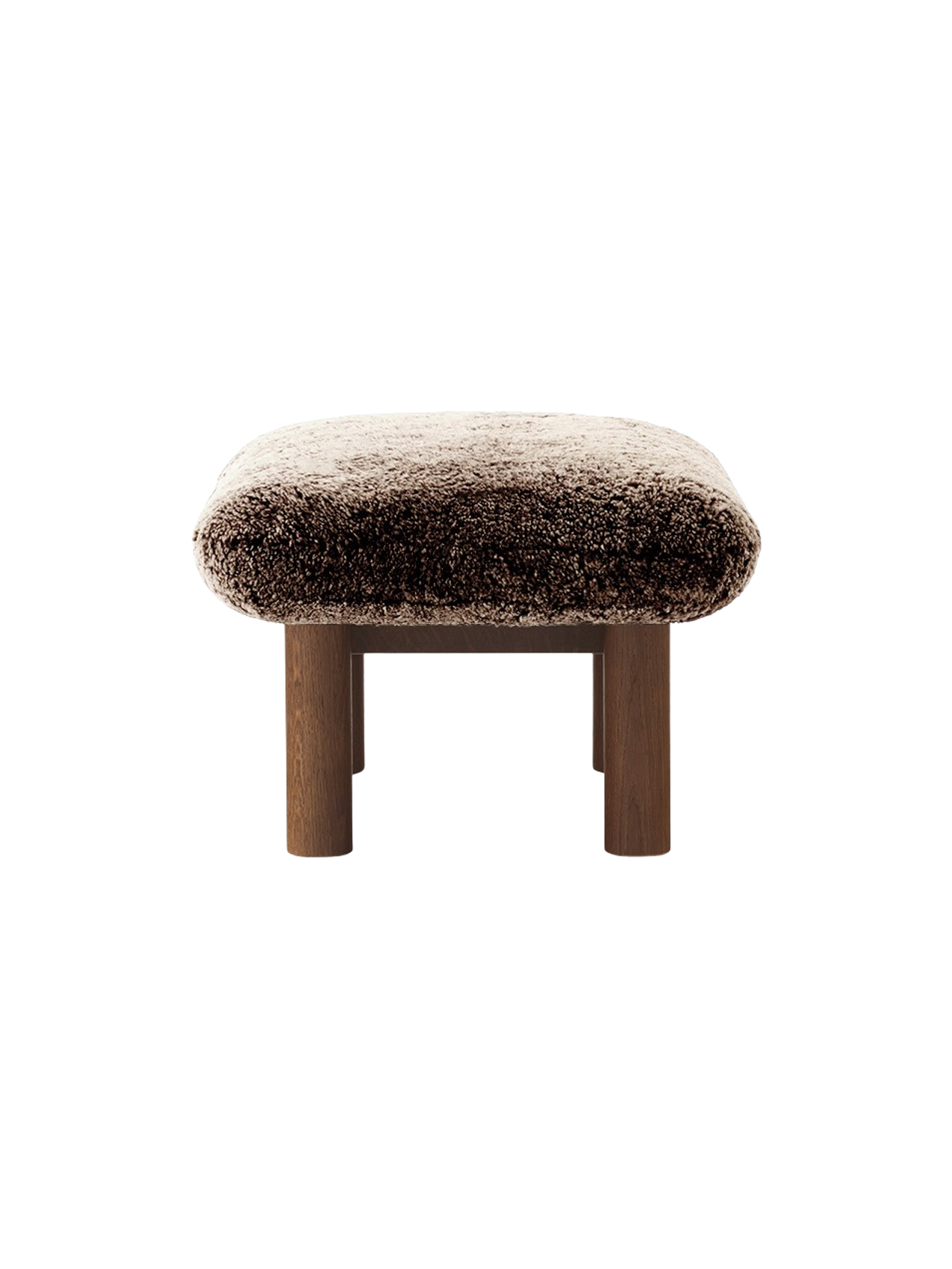 Side view of the Brasilia Ottoman with a plush Sheepskin Root cushion on a dark stained oak base with cylindrical legs.