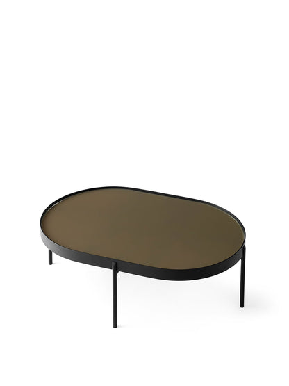 The large NoNo Table with an oval brown glass top and slender black metal frame, pictured at an angle on a white background.