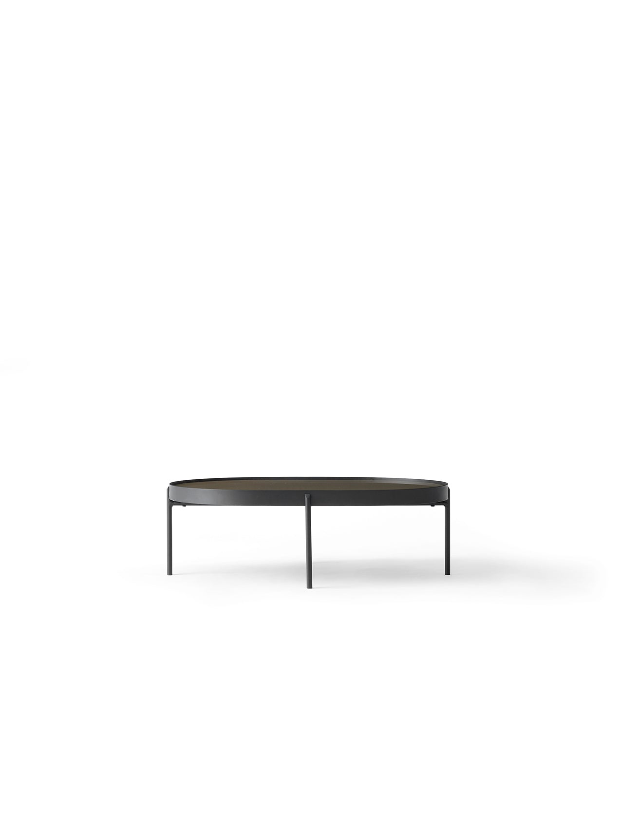 Front view of the large NoNo Table with an oval brown glass top and slender black metal frame and legs on a white background.