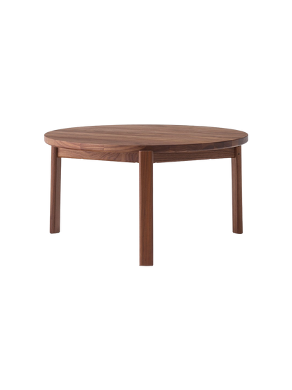 A solid walnut Passage Lounge Table with a round top and four straight legs, against a plain black background.