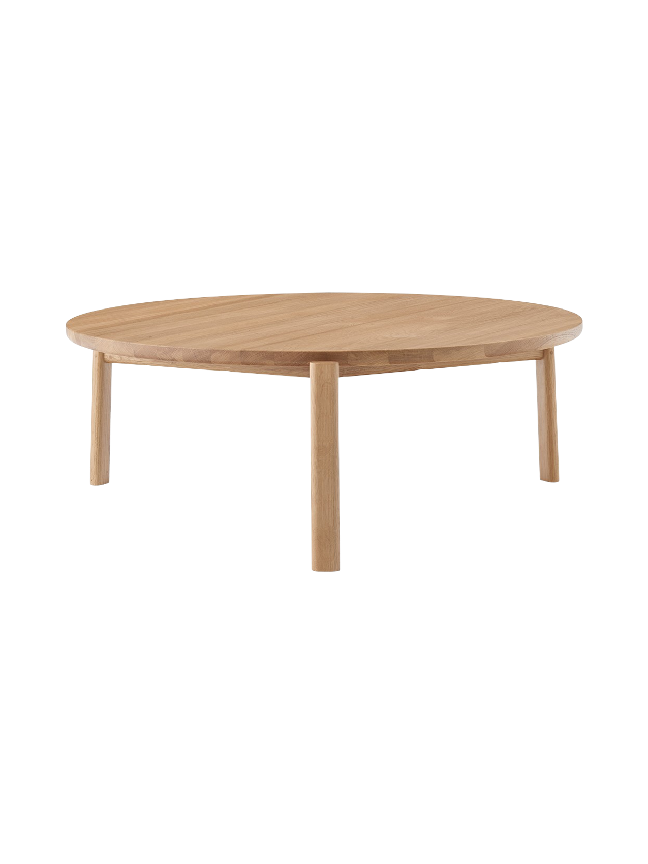 Front view of the Passage Lounge Table in natural oak. The low, round table has a solid wood top and three sturdy legs.