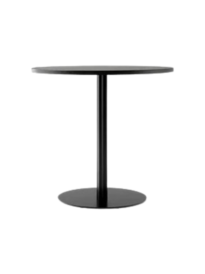 A front-on view of the Harbour Column Dining Table with a round charcoal linoleum top and a black column on a round base.