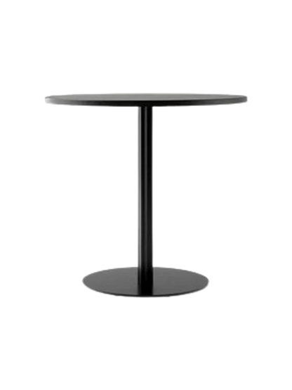 A Harbour Column Dining Table with a round, black oak veneer top and a matching black metal column with a circular base.