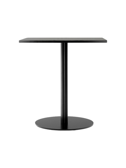 A Harbour Column Dining Table with a rectangular black veneer top and a matching black metal column with a round base.