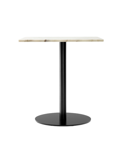 The Harbour Column Dining Table with a rectangular off-white marble top, standing on a single black column with a round base.