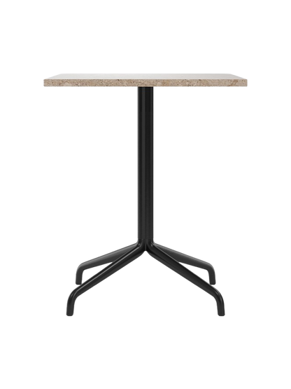 Front view of the Harbour Column Dining Table featuring a rectangular Kunis Brescia stone top and a black metal star base.