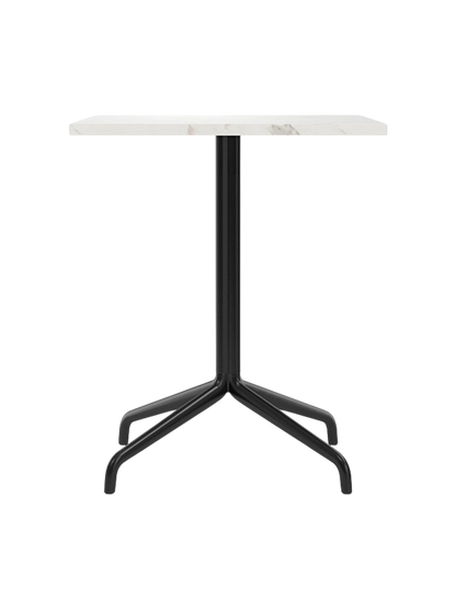 Front view of the Harbour Column Dining Table. It has a rectangular white Estremoz marble top and a black star base.