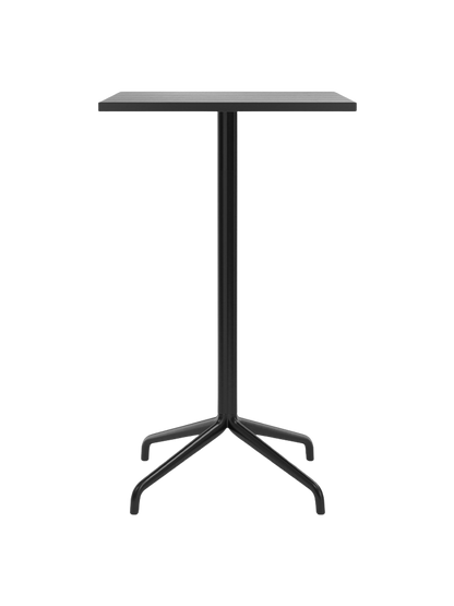 A front view of the Harbour Column Bar Table featuring a rectangular black oak top on a slender black column and a star base.