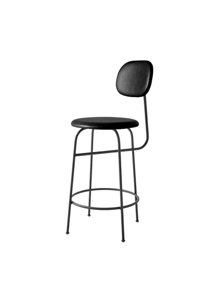 A black Afteroom Counter Chair Plus, shown at an angle, with a thin metal frame, a round upholstered seat and backrest.