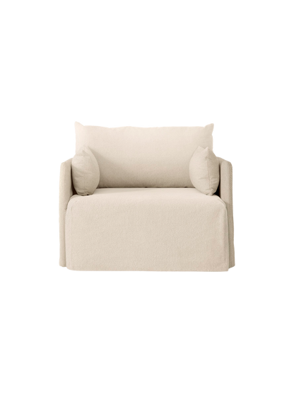 Front view of the one-seater Offset Sofa. It has a relaxed silhouette with a textured, light beige Logan Jasmine loose cover.