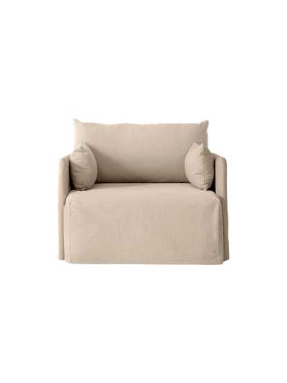 Frontal view of the Offset 1-Seater Sofa with a sand-coloured loose cover, large back cushion and two smaller side cushions.