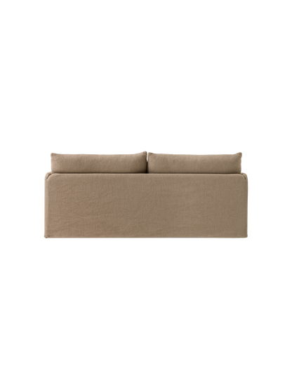 A back view of the Offset Sofa with Loose Cover, a two-seater model upholstered in textured, light brown Flint fabric.