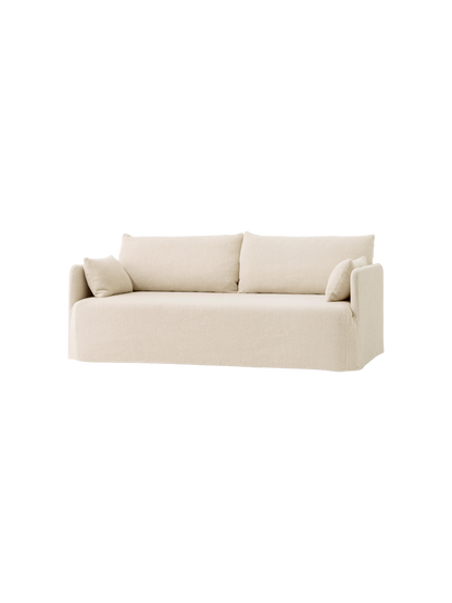 An angled studio shot of the Offset Sofa with Loose Cover. This 2-seater is upholstered in light, textured Jasmin fabric.