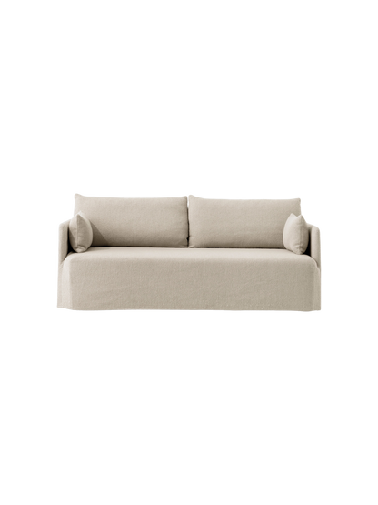 The Offset Sofa with Loose Cover, a 2-seater model shown from the front, upholstered in a sand-coloured textured fabric.