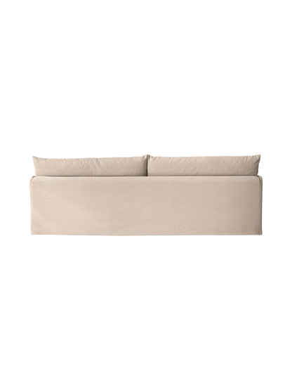 A back view of the sand-coloured Offset Sofa, a 3-seater with a loose cover, showing the two plush back cushions.