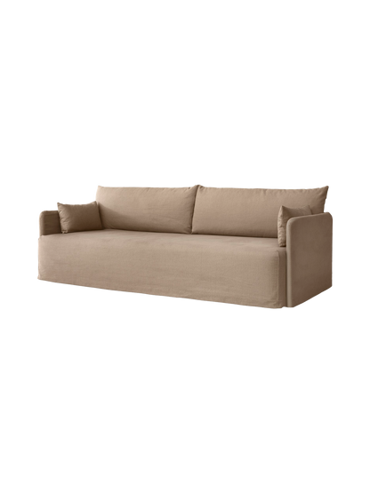 Angled view of the 3-seater Offset Sofa with a loose cover in a textured, light brown Flint fabric against a plain backdrop.