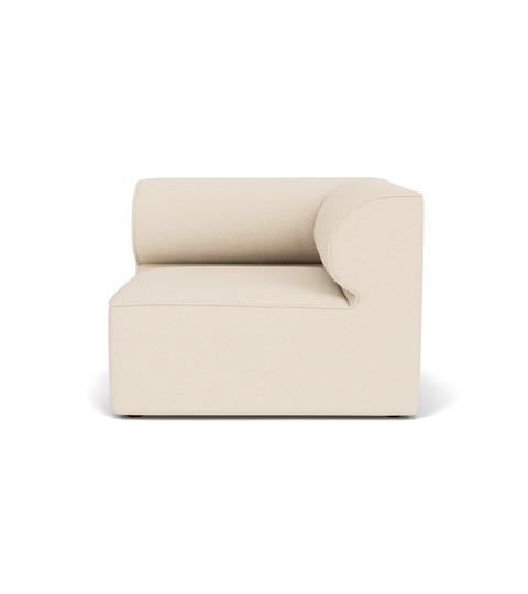 The Eave Modular Sofa, 96, Corner unit, seen from the front. It features a blocky base and a curved armrest in light fabric.