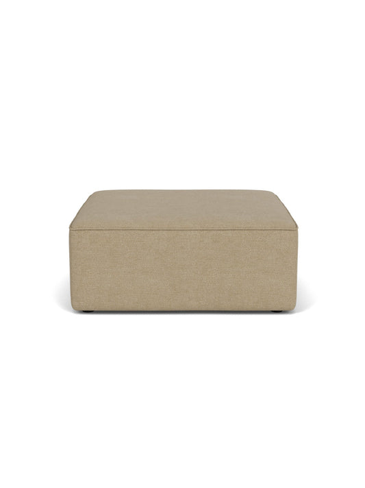 Front view of the Eave Modular Sofa Pouf, a square ottoman in light brown Audo Bouclé 02 fabric on a white background.