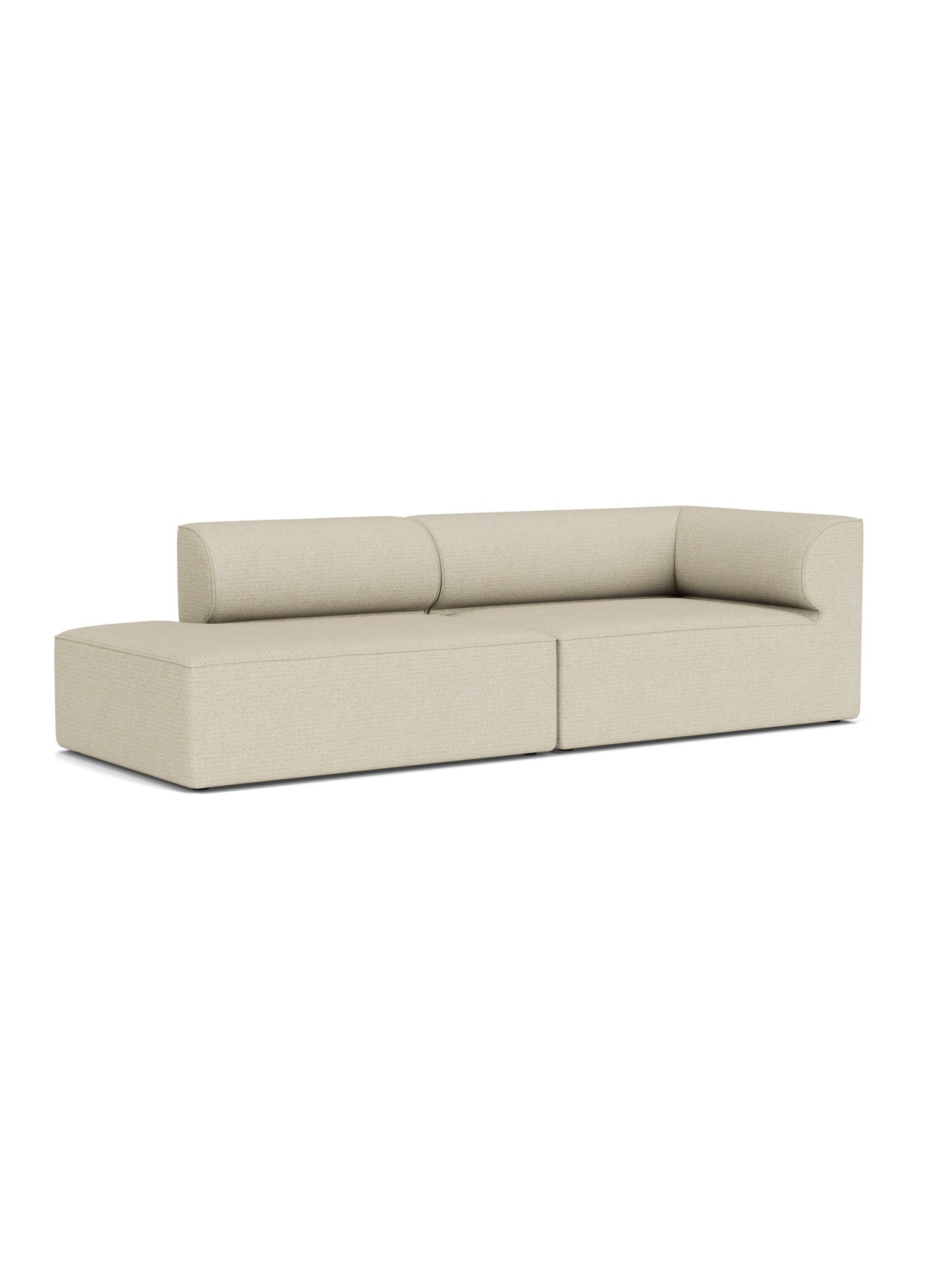 A light beige Eave Modular Sofa, 96, Configuration 4, shown at an angle, with a chaise longue and curved arm and back rests.