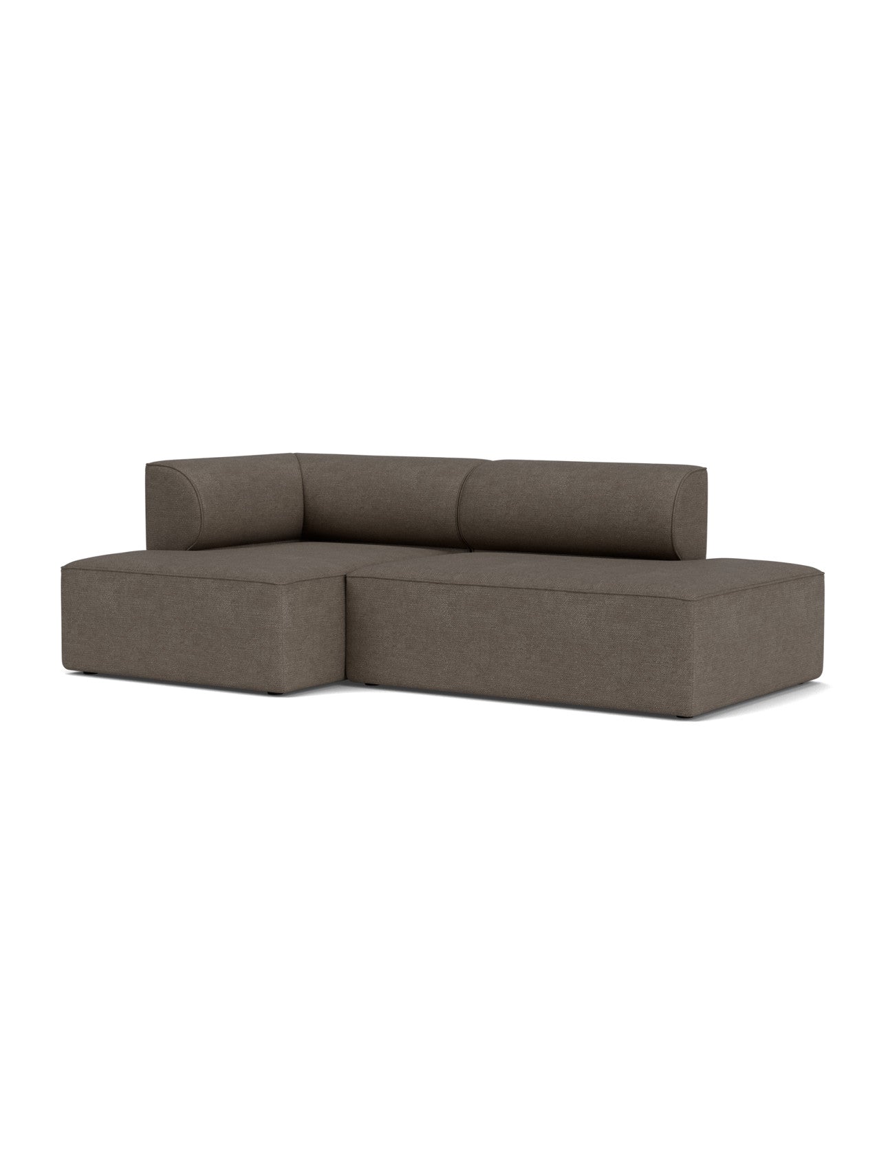 An angled view of the Eave Modular Sofa, 2.5-seater Configuration 7. It is an L-shaped sofa in a dark brown bouclé fabric.