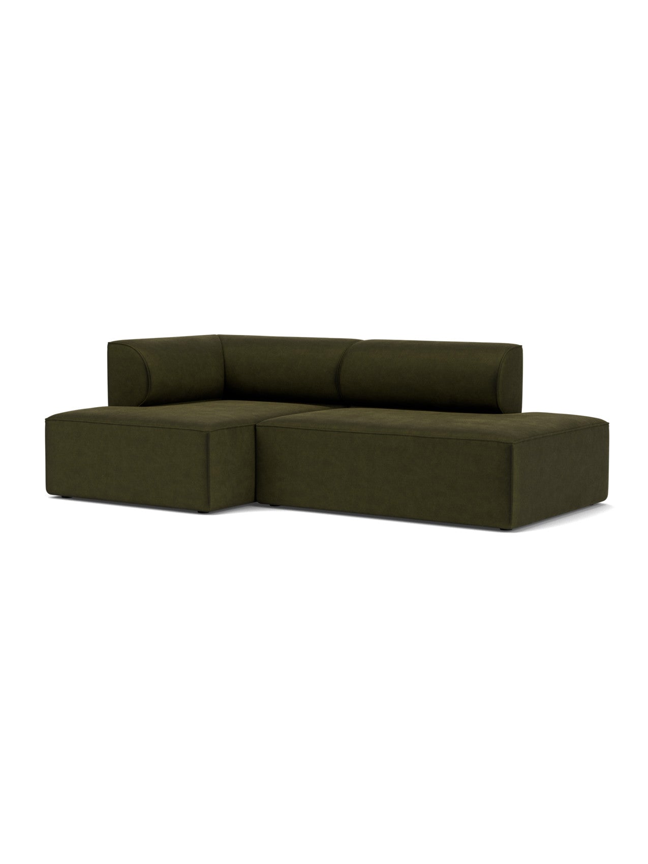 An angled view of the Eave Modular Sofa 96, Configuration 7. The L-shaped sofa is upholstered in dark green Champion fabric.