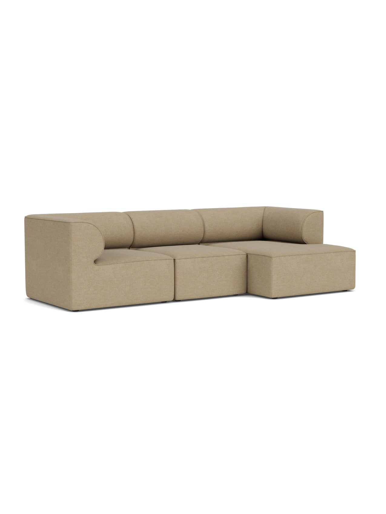 Angled view of the Eave Modular Sofa, 3-seater Configuration 11. An L-shaped sofa with a right chaise longue in beige bouclé.