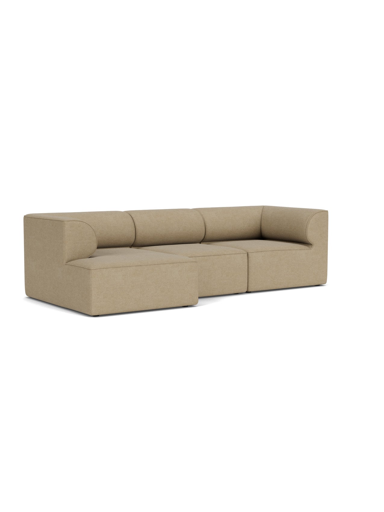 Angled view of the Eave Modular Sofa, 96, a 3-seater L-shaped sofa with a left chaise longue in light brown bouclé fabric.