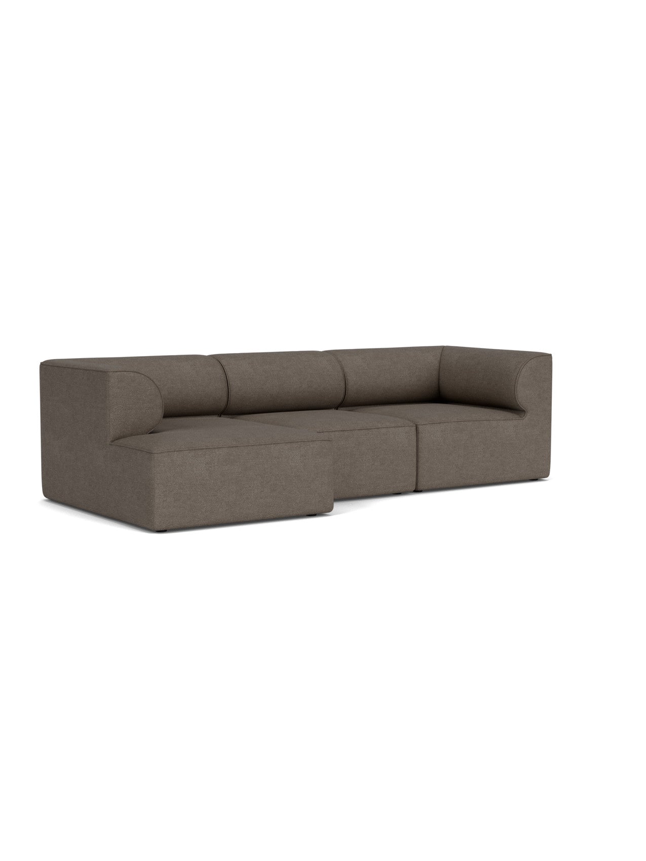 Angled view of the Eave Modular Sofa, 96, Configuration 12. The L-shaped sofa in brown bouclé has a left chaise longue.