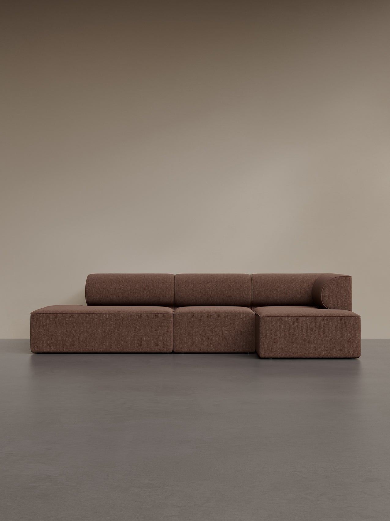 The Eave Modular Sofa, 86, 3.5-seater, configuration 9, shown in a brown bouclé fabric against a neutral beige wall.