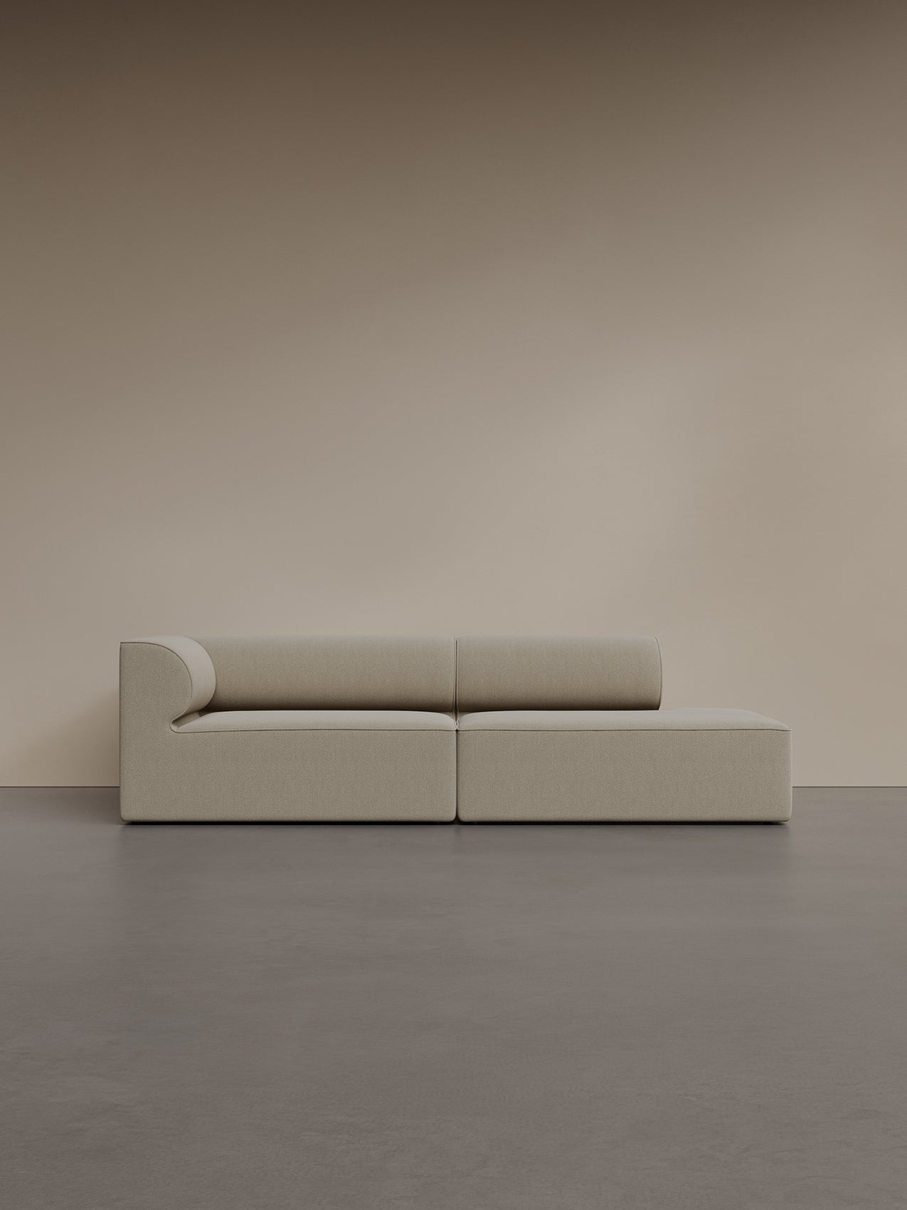 The Eave Modular Sofa 2.5-seater, Configuration 3, in Audo Bouclé 02 fabric, seen from the front in a minimalist setting.