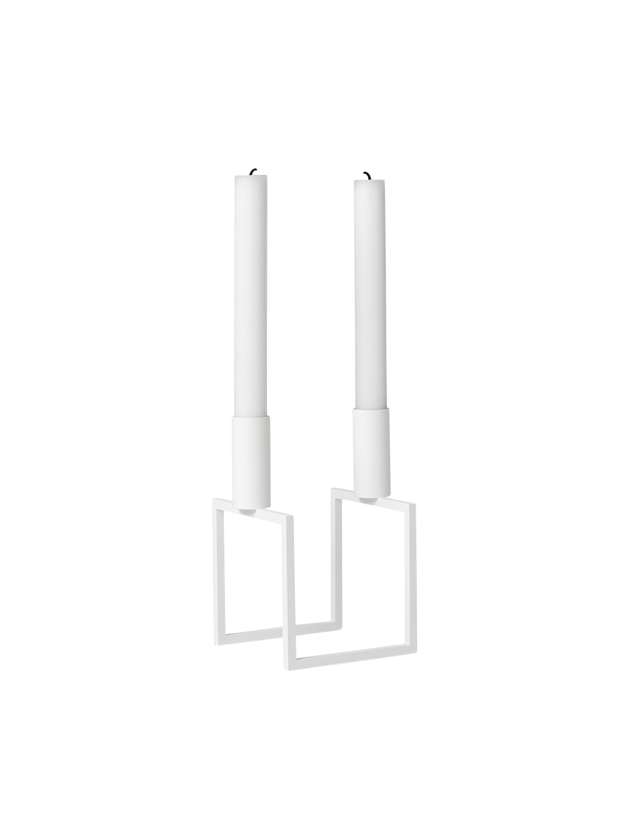 An angled view of the white Kubus Line candlestick, a minimalist design with a geometric frame, holding two white candles.