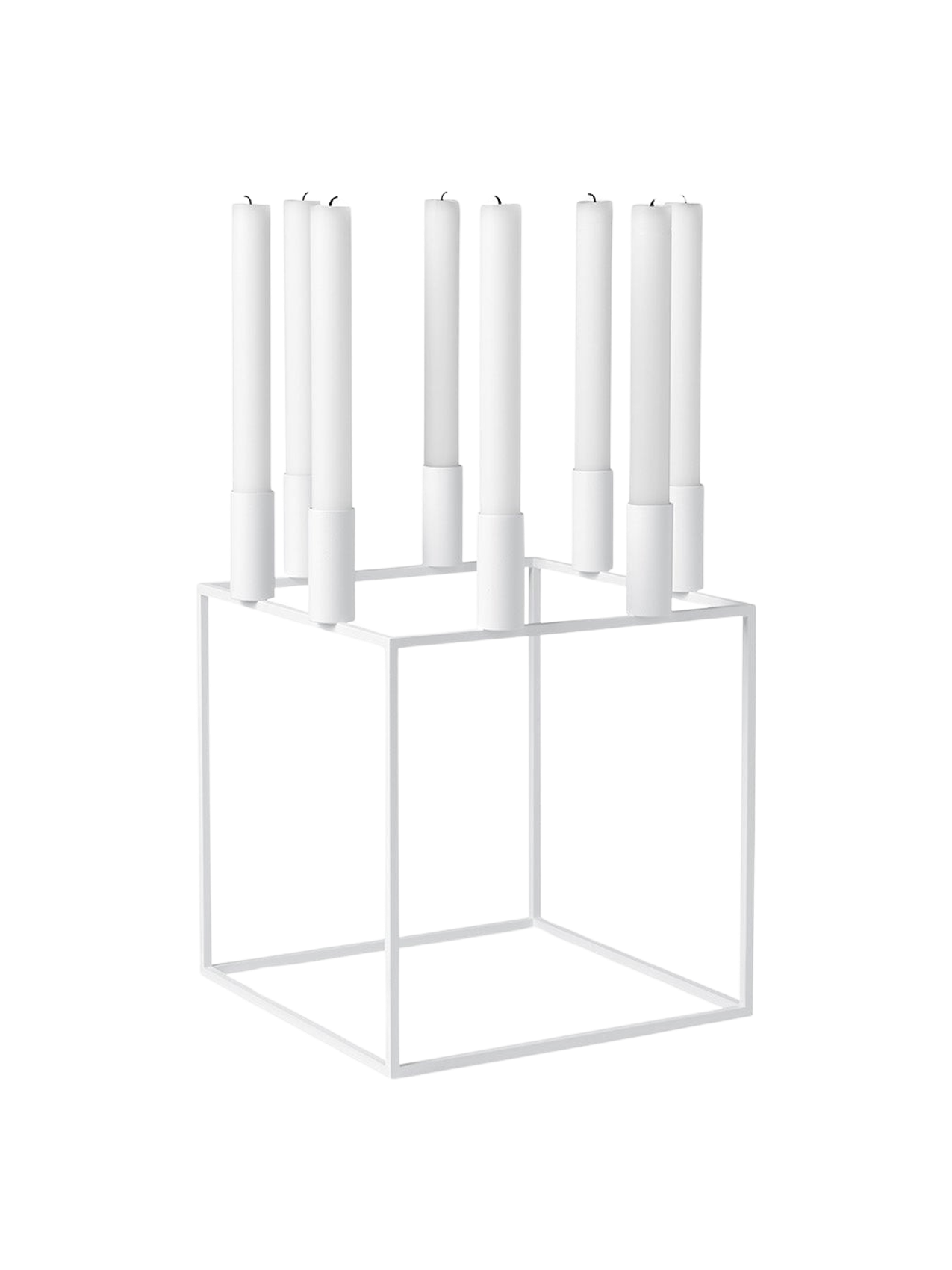 A white Kubus 8 candle holder with a minimalist cube frame, holding eight tall white candles on a black background.
