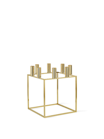 Geometric Kubus 8 candle holder in a gold-plated finish, featuring a square frame and eight holders, on a white background.