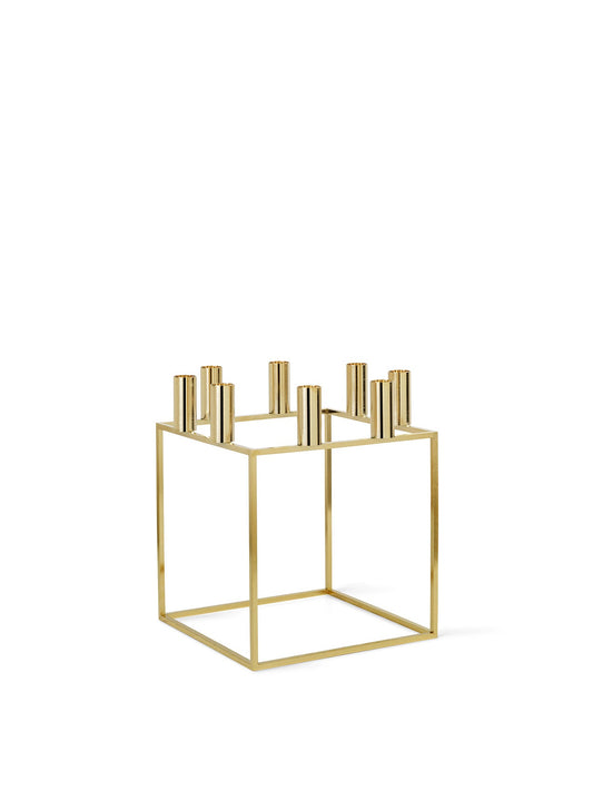 Geometric Kubus 8 candle holder in a gold-plated finish, featuring a square frame and eight holders, on a white background.