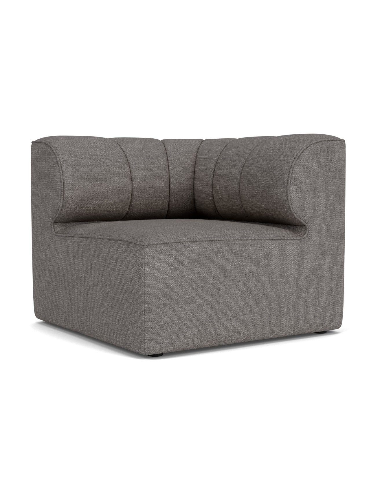 The Eave Seamline Modular Sofa 86 Corner module in dark grey Audo Bouclé fabric, showing its curved, seamed backrest.