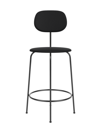 A black Afteroom Counter Chair Plus with a textured, upholstered round seat and wide backrest, on a thin black metal frame.