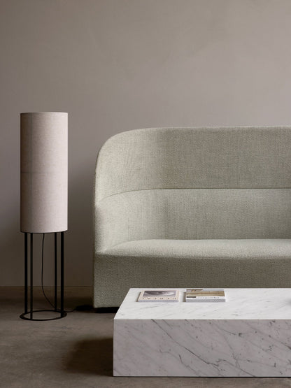 A minimalist room featuring the Tearoom Sofa High Back, Hashira Floor Lamp High, and a Plinth Grand marble coffee table.
