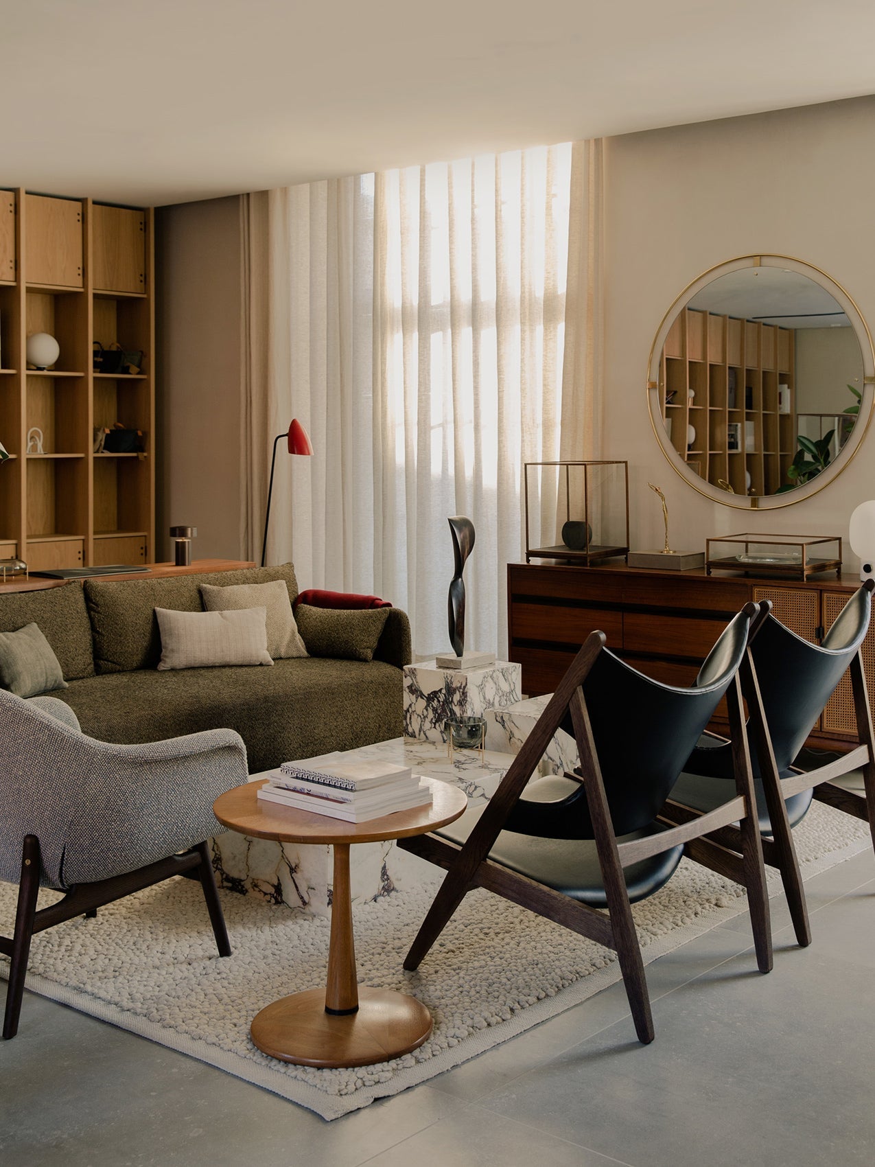 A stylish living room with the Offset Sofa, Harbour Lounge Chair, Knitting Chairs, Plinth coffee table, and Nimbus Mirror.