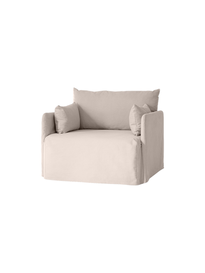 Angled view of the one-seater Offset Sofa with Loose Cover in a light grey fabric, shown against a solid black background.