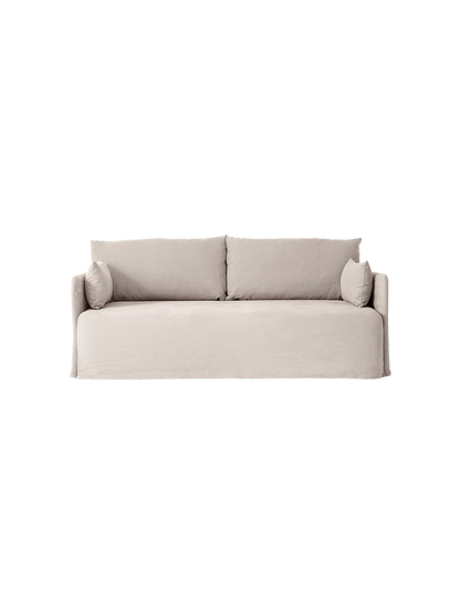 Front view of the light grey Offset Sofa w/ Loose Cover. It has two large back cushions and two small side cushions.