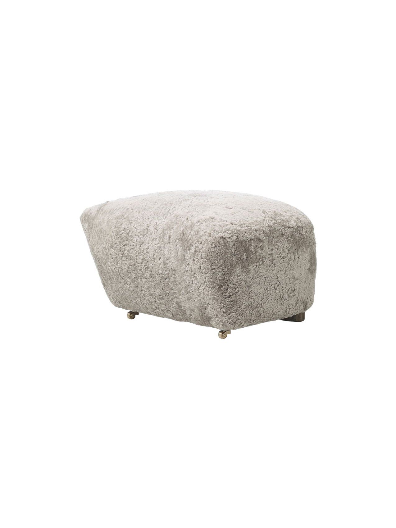 Three-quarter view of The Tired Man Ottoman in plush Green Tea Sheepskin, highlighting its soft texture on a black background
