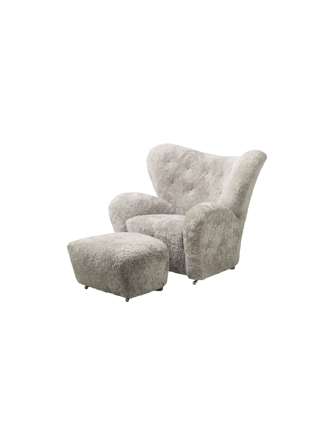 The Tired Man Ottoman, shown with the matching armchair. Both are upholstered in plush, green-tea coloured sheepskin.